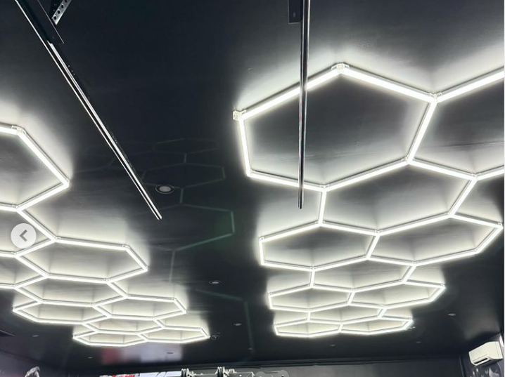 2 set of long 11 grid hexagon lighting in black ceiling